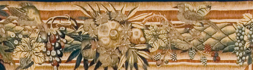Bordo con frutta e uccelli nell'arazzo in lana e seta  "Storie di Giacobbe: Giacobbe lascia la casa paterna per recarsi in Mesopotamia "  